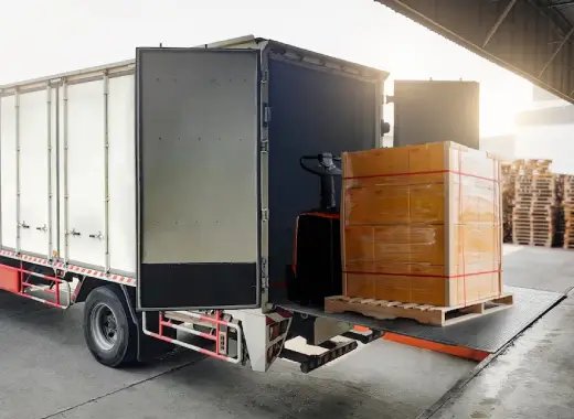 Forklift transferring pallets at FLC Freight loading dock